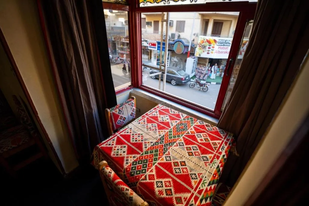 Private balcony overlooking the lively streets of Luxor